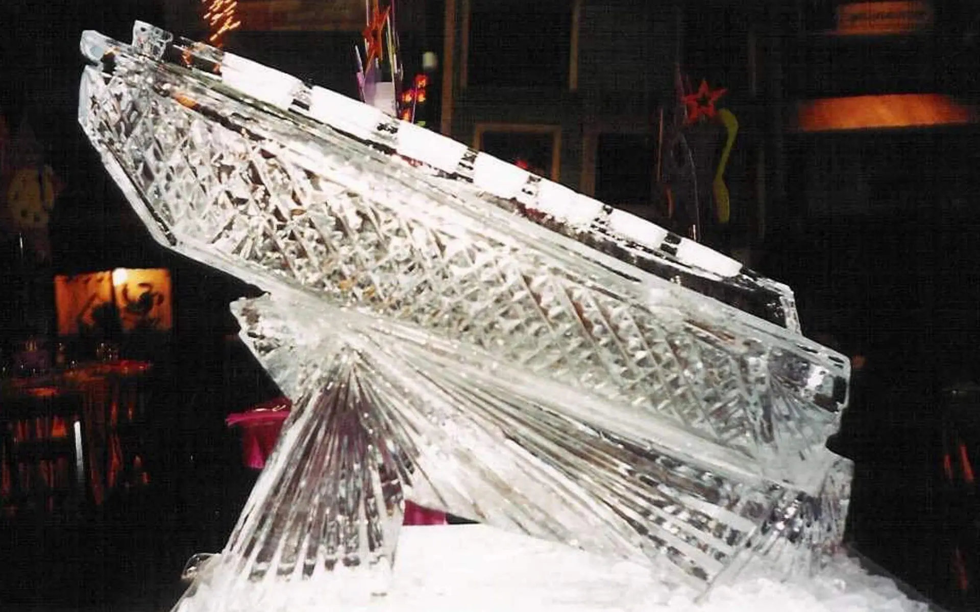 Carved ice party server lit from below